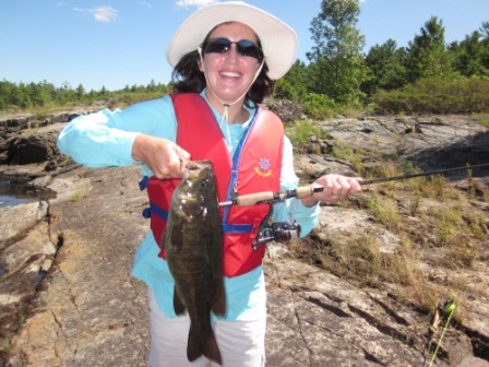 Amy New Gear French River Smallie Summer 2011.jpg - Amy with her new rod and reel.